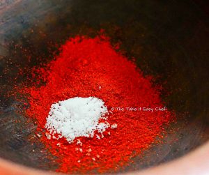 Mix chilli powder and salt in water and bring to boil
