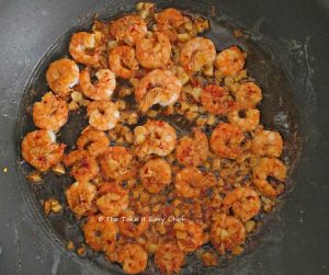 Turn the prawns over and fry on the other side