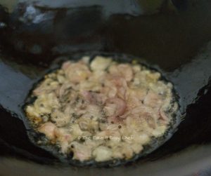 Moringa Leaves Stir-Fry Steps Image - Tempering mustard seeds followed by shallots