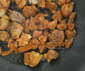 Lamb pieces browned on a pan