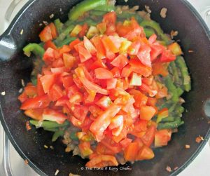 Tomatoes are added to the pan