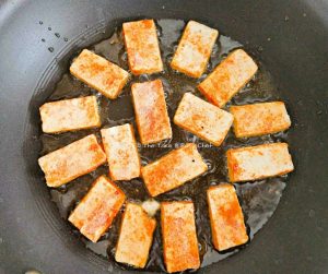 Paneer is lightly fried till the coating starts turning brown