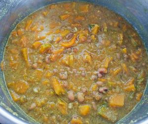 Ground coconut mix is added to the cooker