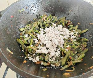 Grated coconut is added to complete the cooking