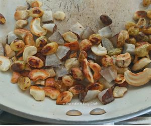 Cashews, raisins and coconut chips fried till golden brown