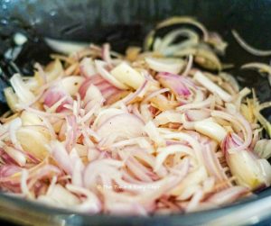 Into the same pan, add oil, and fry onions, ginger, and garlic