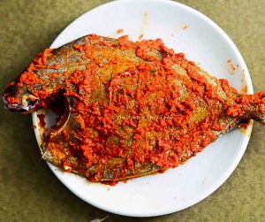 Fish coated with marinade ready to fry
