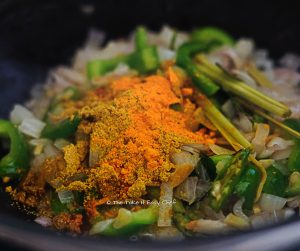 Add turmeric powder and coriander powder