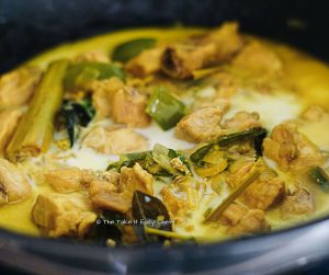 Add coconut milk to complete the lemongrass chicken