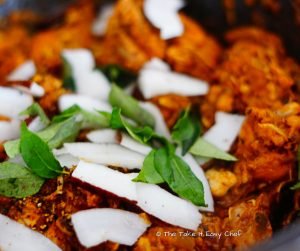 Add curry leaves and coconut chips