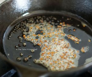 Temper mustard seeds and fenugreek seeds in oil