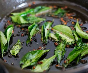 Add curry leaves to the mix