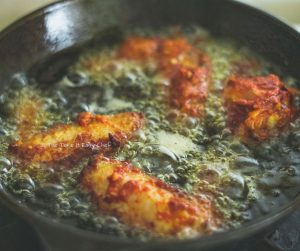 Picture of Easy Indian Chicken Wings Steps - Frying in hot oil