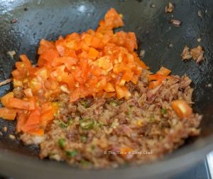 Keema Paratha Step picture- Adding chopped tomato