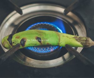 Vazhuthananga Udachathu (Roasted Brinjal Eggplant Aubergine Kerala Style) Steps - Roasting on a flame