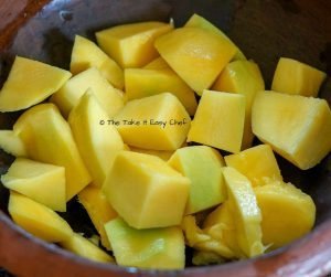 Mambazha Pulissery Steps - Mangoes are peeled and sliced